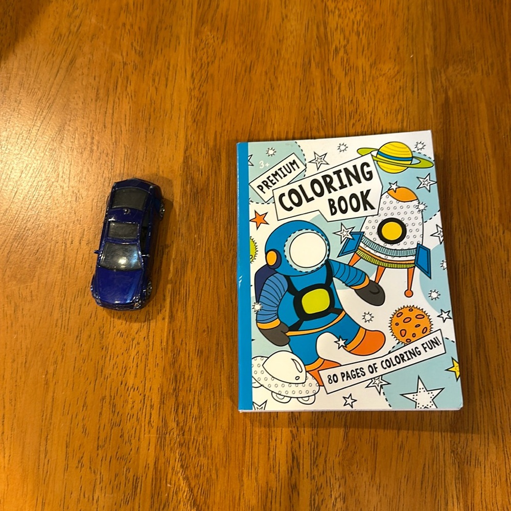 Boys mini coloring book and matchbox blue Cadillac.